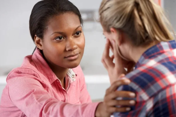 A woman is talking to another person