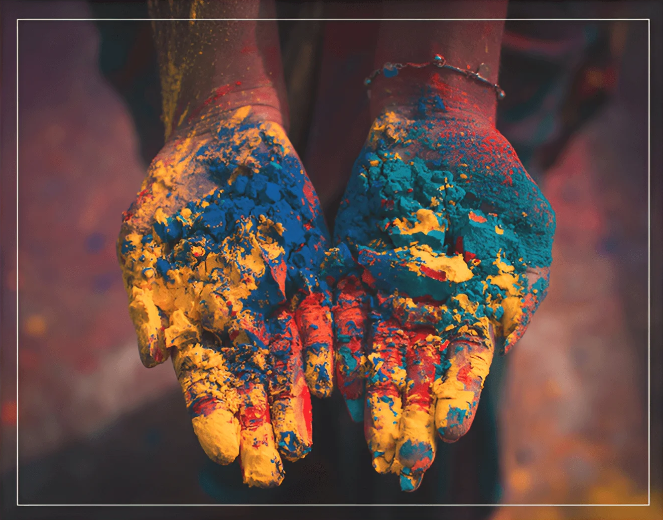 A person 's hands covered in paint.